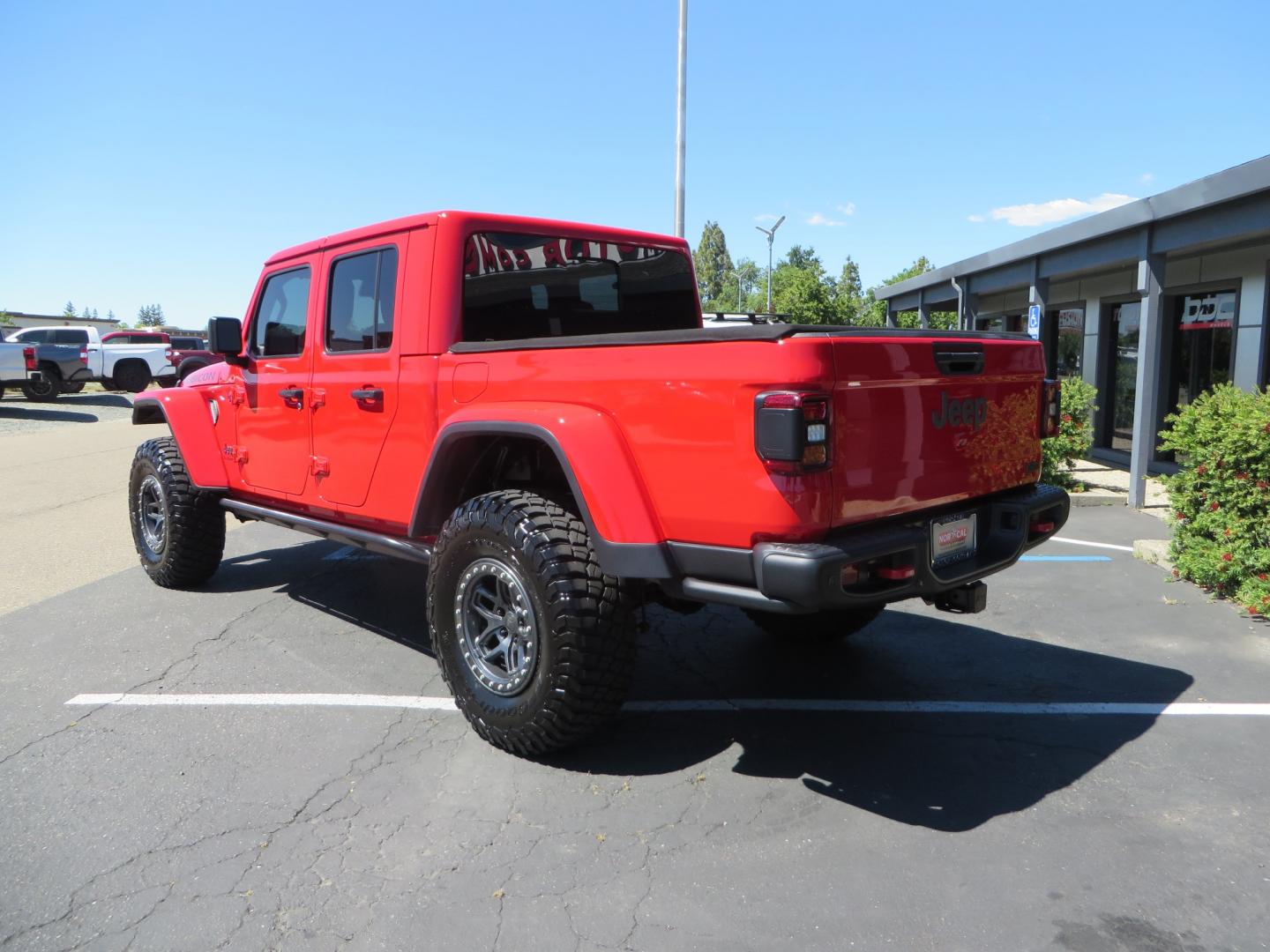 2020 Red /black Jeep Gladiator Rubicon (1C6JJTBG6LL) with an 3.6L V6 DOHC 24V engine, 6M transmission, located at 2630 Grass Valley Highway, Auburn, CA, 95603, (530) 508-5100, 38.937893, -121.095482 - Rubicon Gladiator featuring a Mopar suspension system with Fox shocks, 17" AEV wheels wrapped in 37" BFG tires, Warn Winch, Rock sliders, Cascade front license plate holder, Impact bedliner, Built Right Industries bed Molle panels, and Window tint. - Photo#6